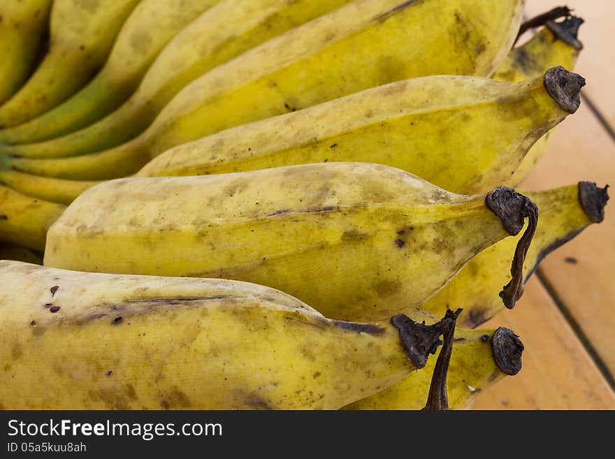 Close up bunch of banana on wooden table