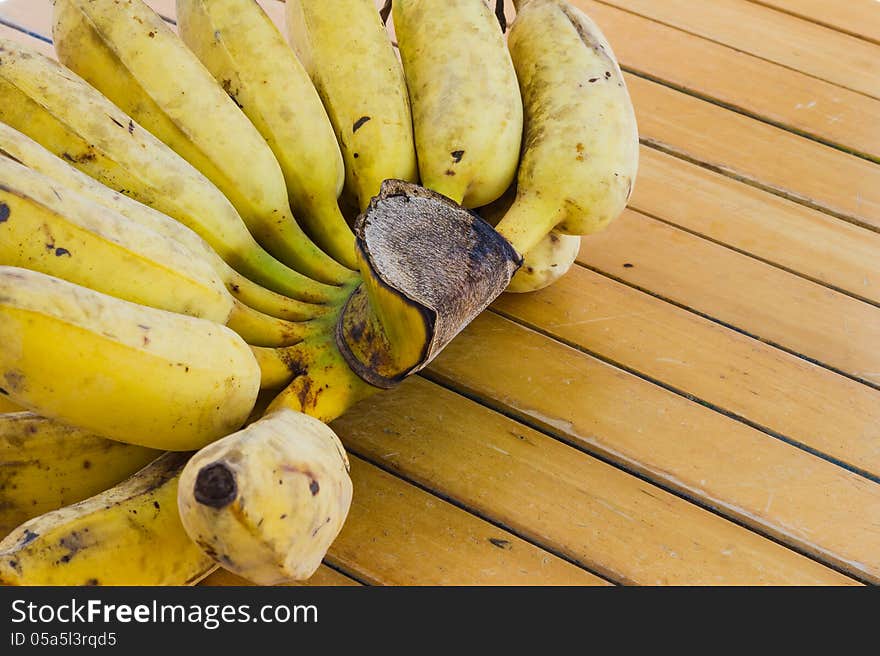 Bunch of banana on wooden table