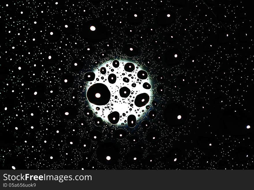 Water drop with moon light background