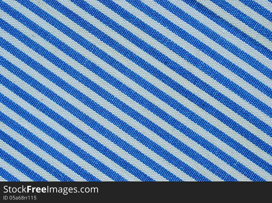 Close up on blue and white line fabric with 30 degree angle background