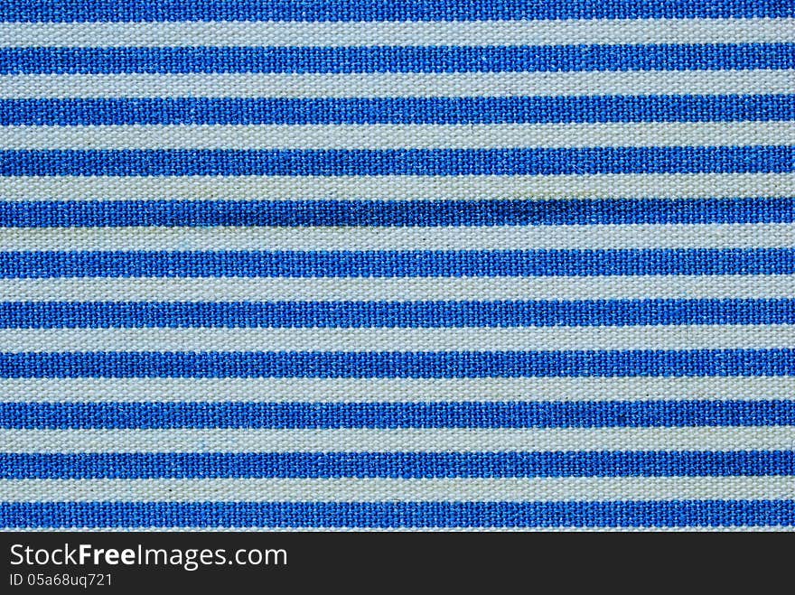 Close up on blue and white line fabric background