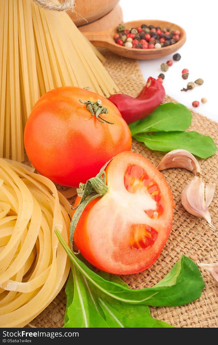 Italian pasta with spices and vegetables, food ingredients