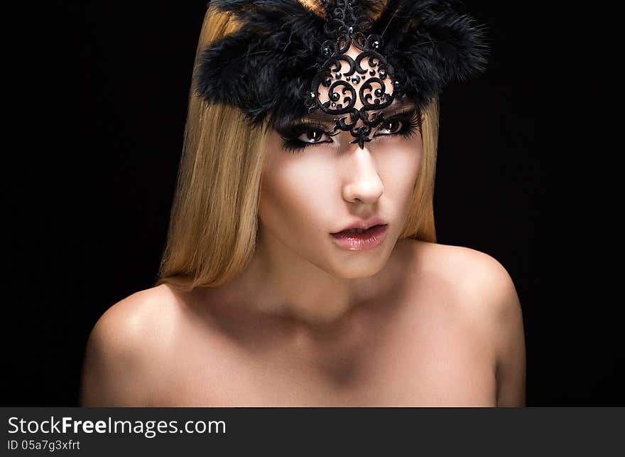 Allure. Fascinating Fancy Woman in Black Carnival Mask with Feathers. View