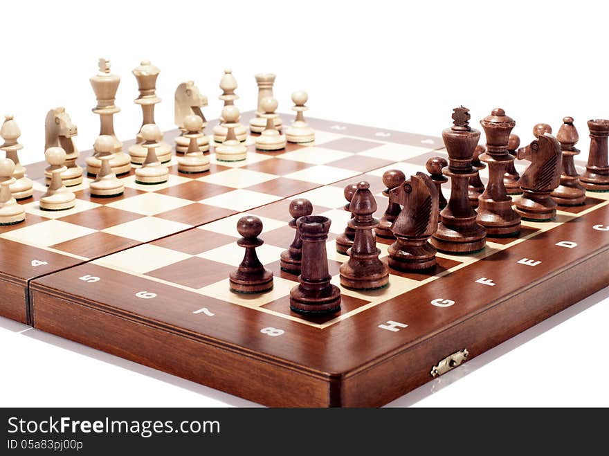 A wooden chess board isolated on white. A wooden chess board isolated on white.