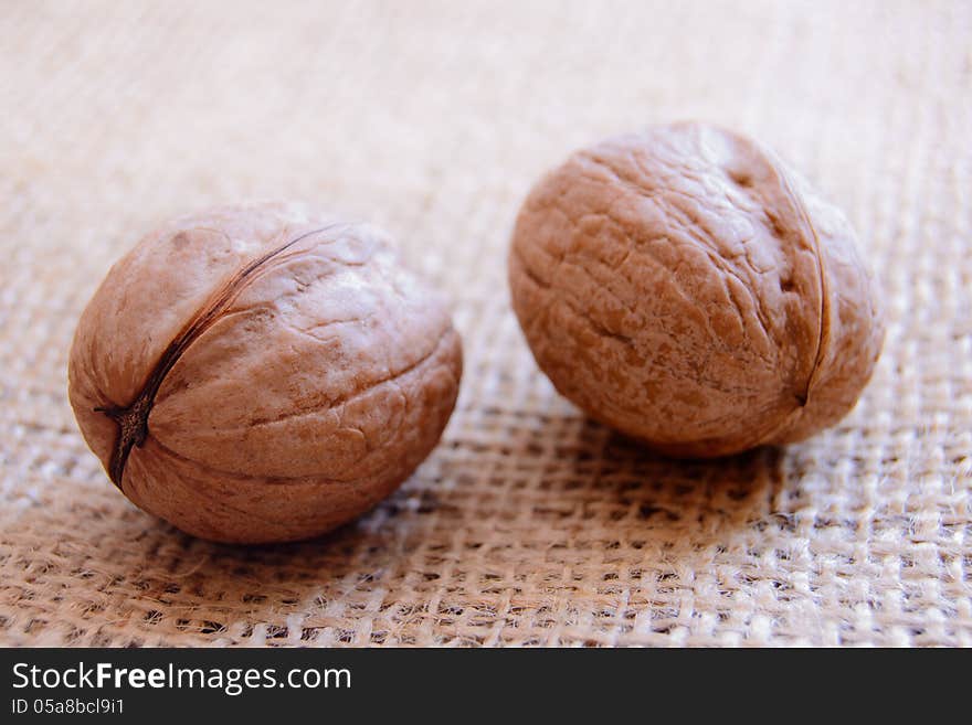 Mature walnuts on woven fabric