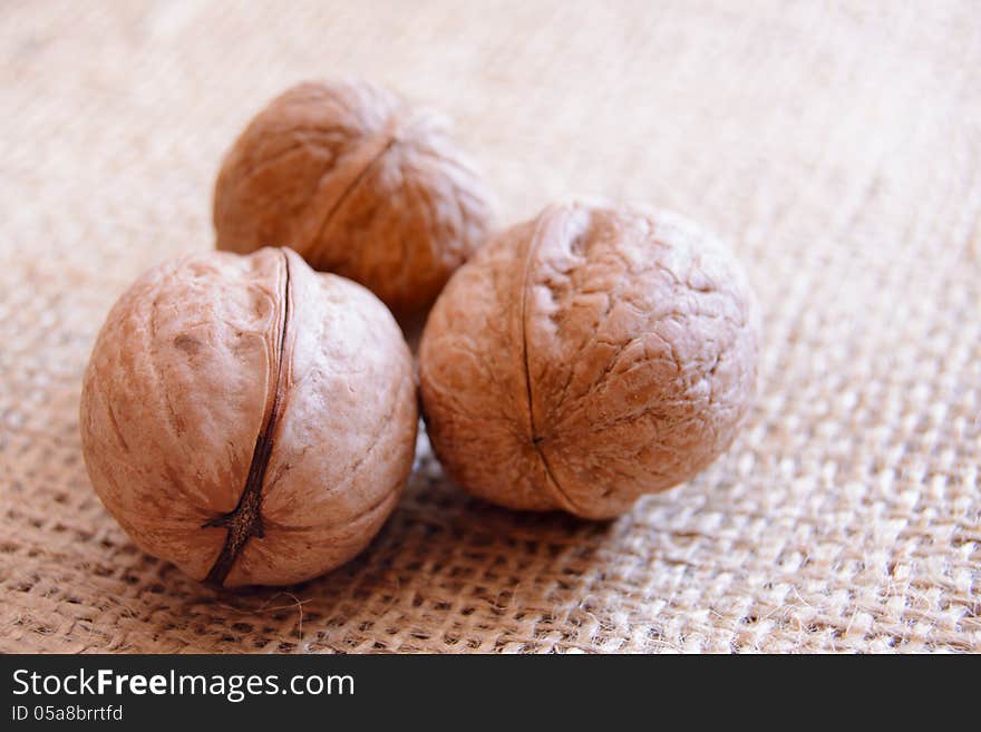 Mature walnuts on woven fabric