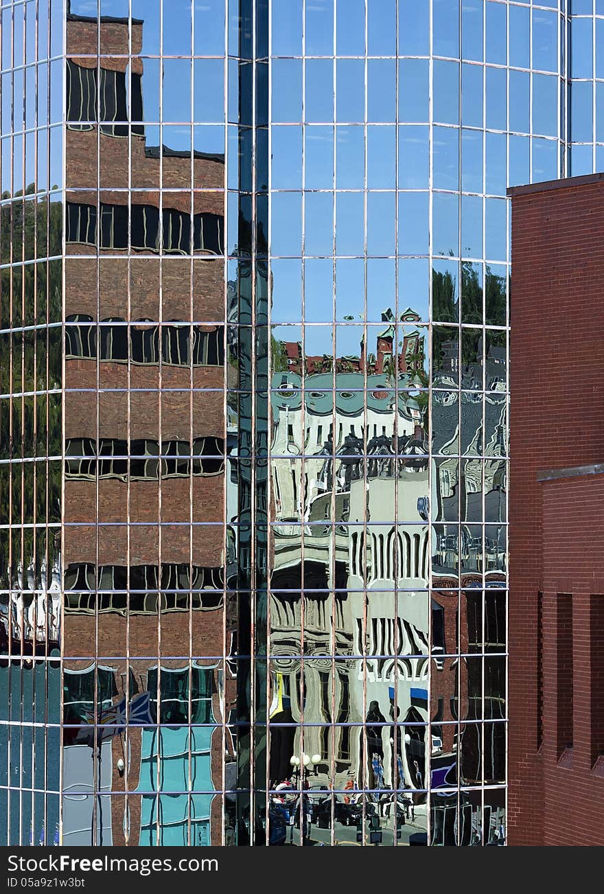 Downtown St. John&#x27;s reflected in the windows of glass buildings on Water Street. Downtown St. John&#x27;s reflected in the windows of glass buildings on Water Street.