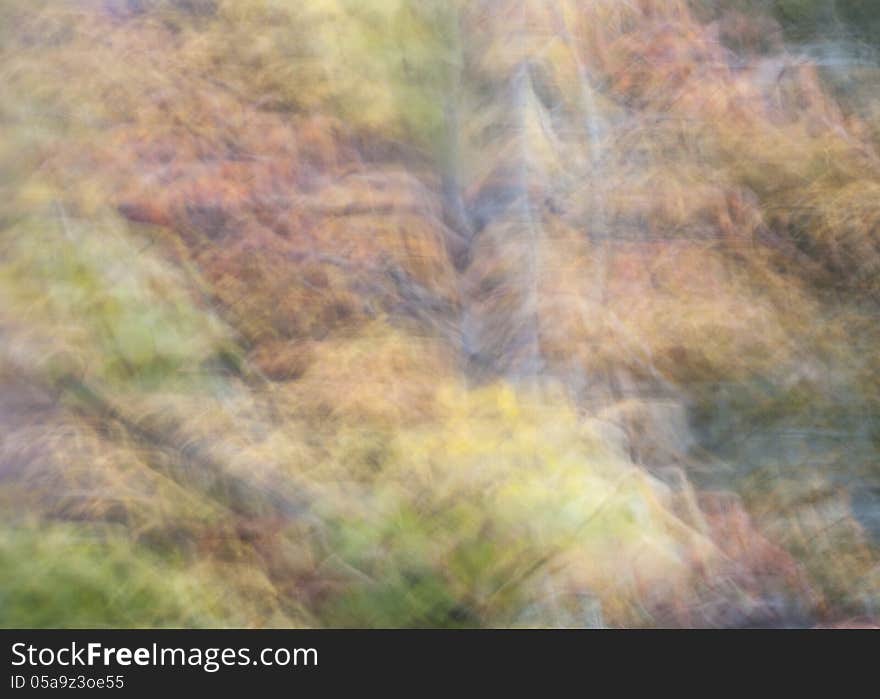 Pastel green, yellow and orange in a blurred wave pattern. Pastel green, yellow and orange in a blurred wave pattern.