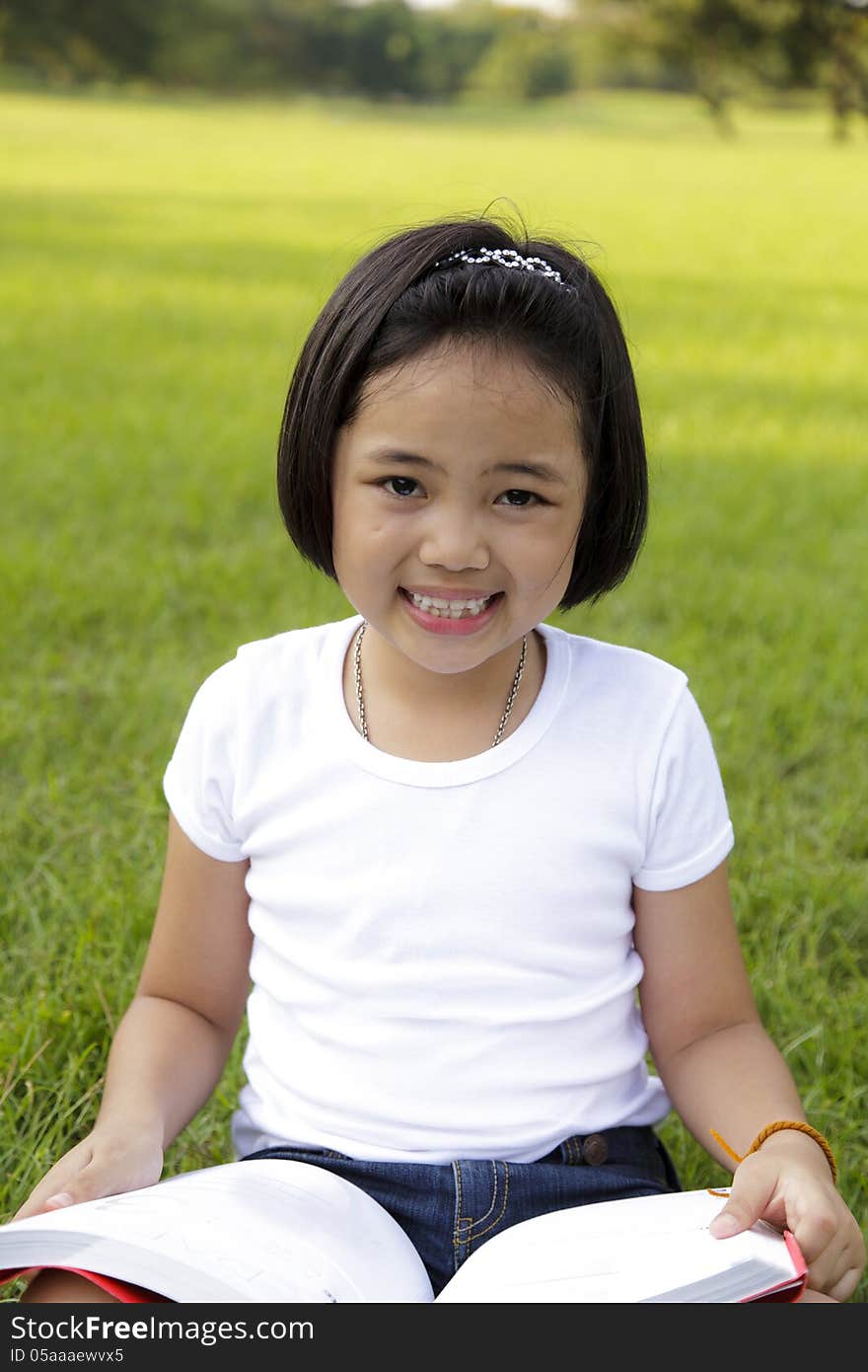 Asian girl reading book