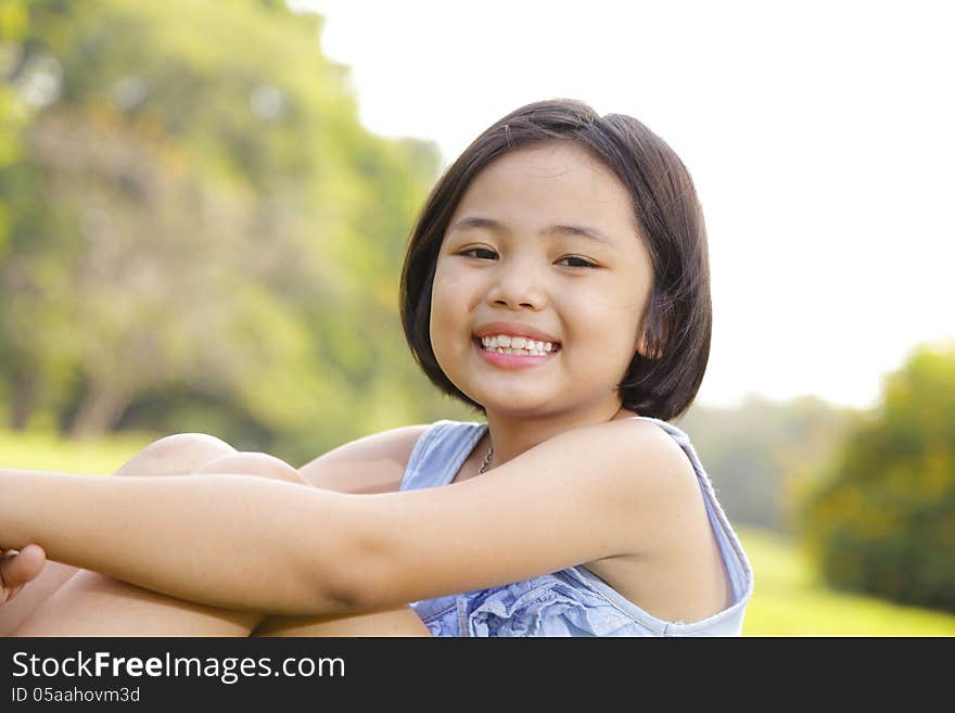 Girl smiling happily in the park