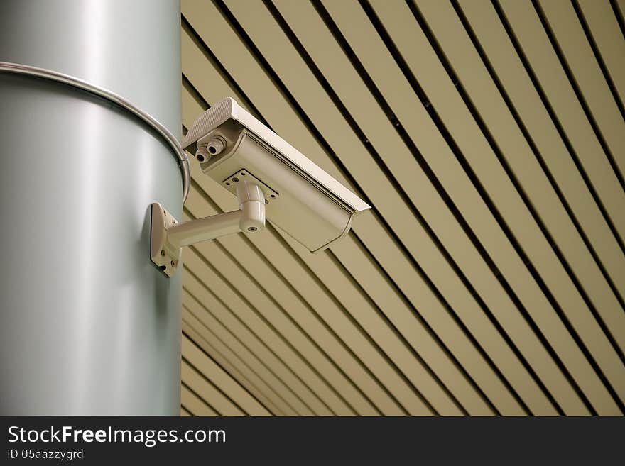 An overhead security camera at a subway station