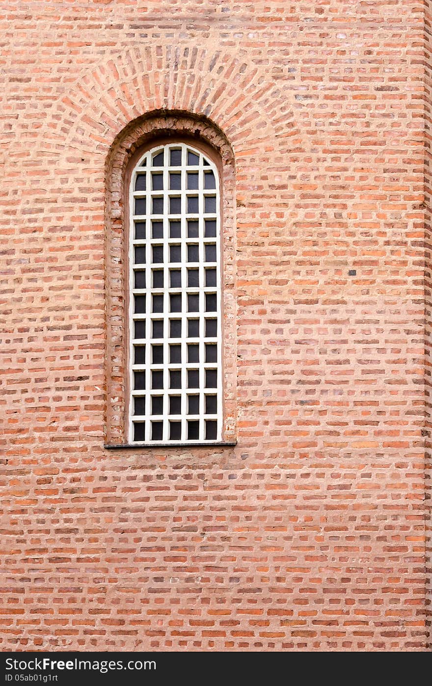 Window and red bricks wall