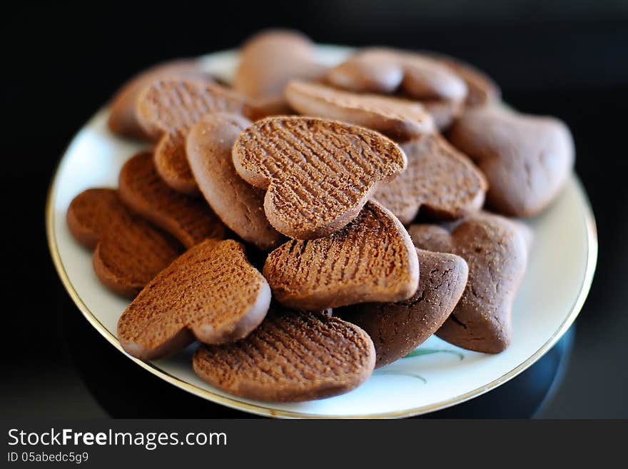 Chocolate biscuits in the shape of a heart on a plate