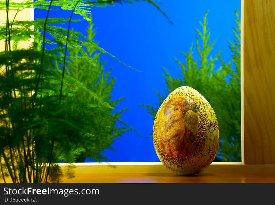 Easter egg, lit morning light from the window. Easter egg, lit morning light from the window