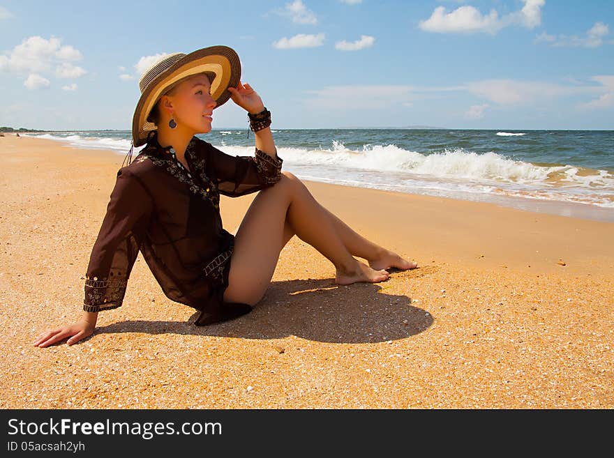 Girl in broun on a summer sea beach. Girl in broun on a summer sea beach