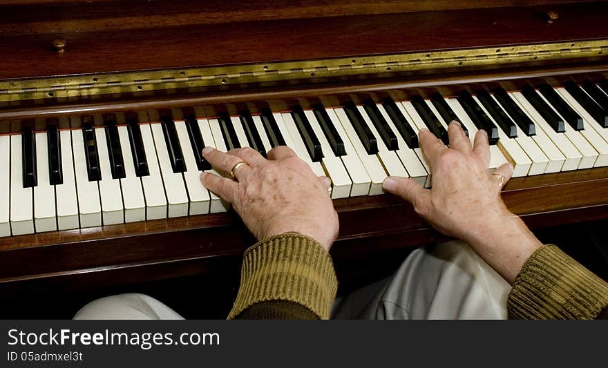 Rear flash, showing slight movement on the hands on the piano.