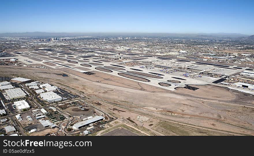 Aerial view of Sky Harbor Airport with the city of Phoenix, Arizona skyline in the distance