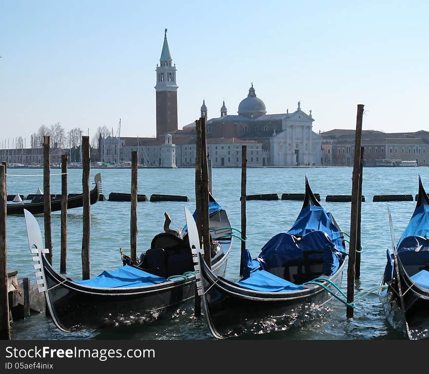 Gondolas in Venice and isle of San Giorgio Maggiore view from St Mark's Square. Gondolas in Venice and isle of San Giorgio Maggiore view from St Mark's Square