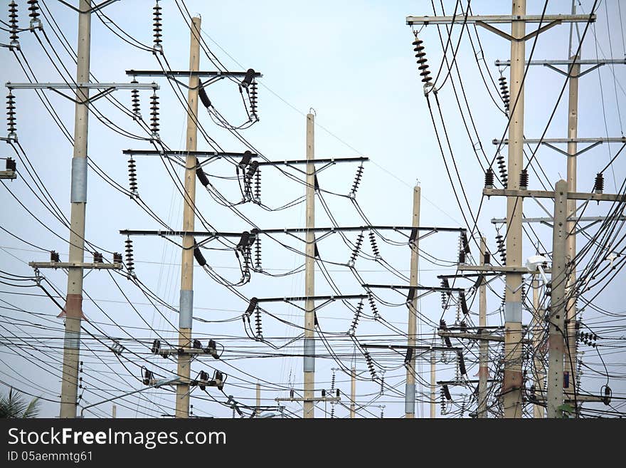 Messy electric cable hanging on the post