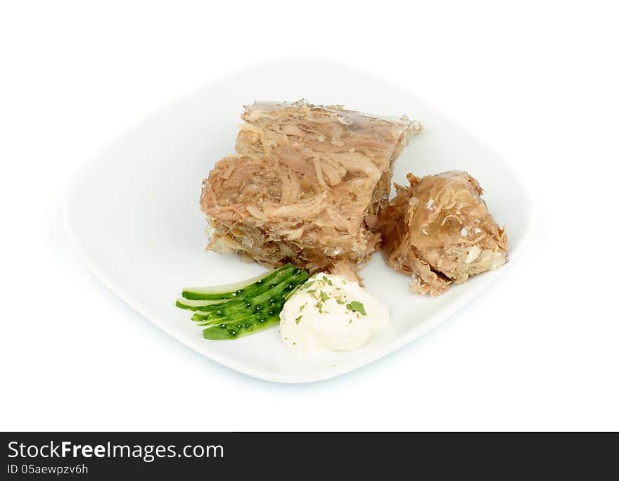 Beef Aspic with Horseradish and Cucumber on White Plate isolated on white background. Beef Aspic with Horseradish and Cucumber on White Plate isolated on white background