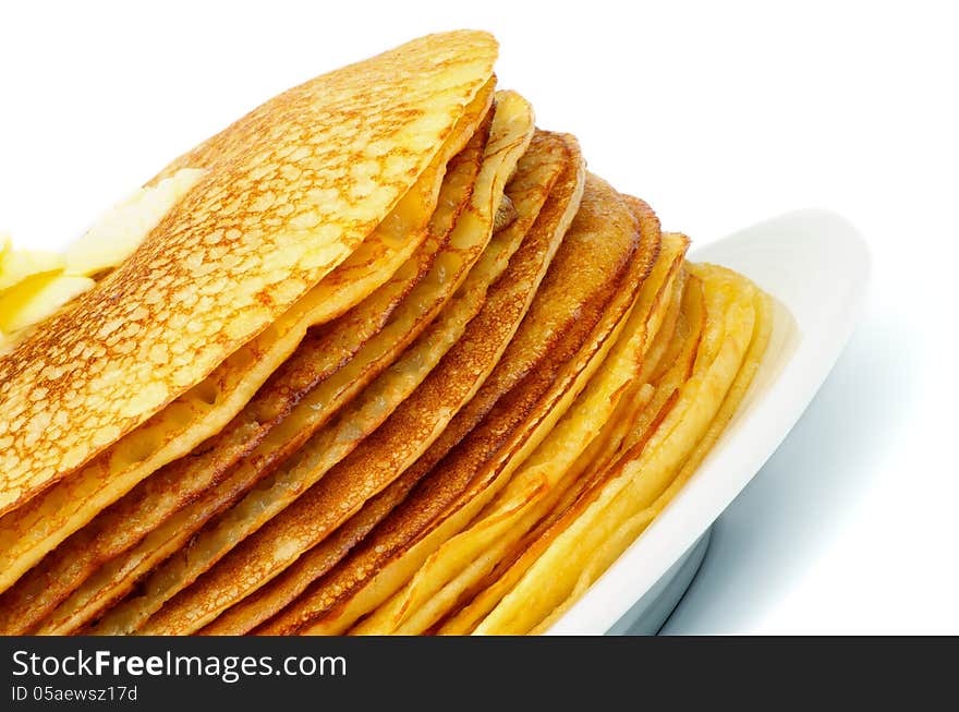 Stack of Delicious Thin Pancakes with Butter on White Plate closeup. Stack of Delicious Thin Pancakes with Butter on White Plate closeup