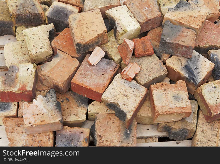 Broken bricks background on yard