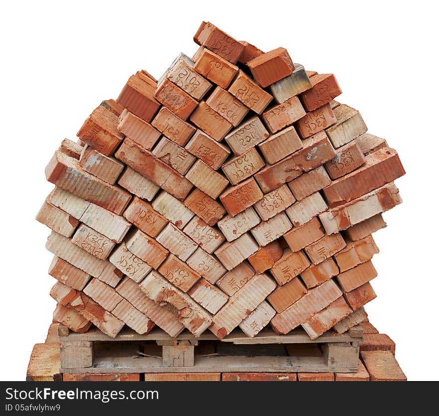 Bricks for next building on wooden pallet isolated on white background