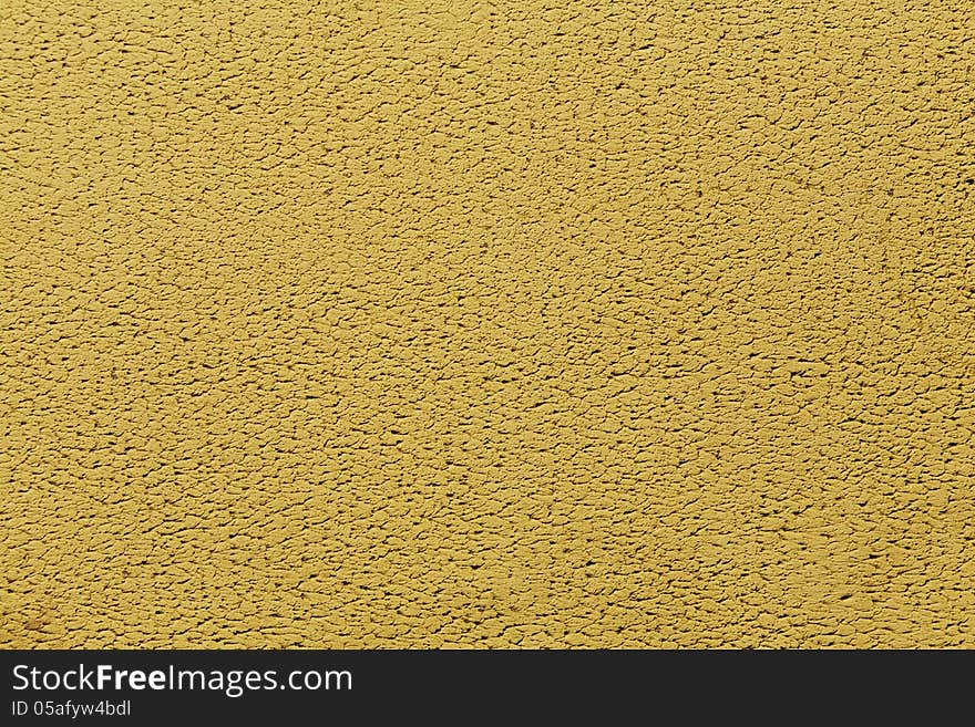 New yellow decorative cement plaster wall background. New yellow decorative cement plaster wall background