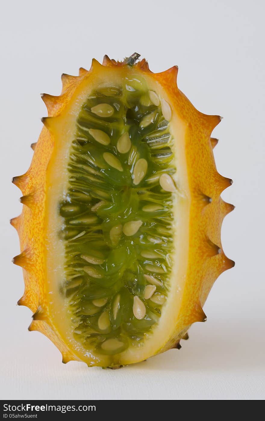 Kiwano or African horned melon over white background. Also known as hedged gourd, African Horned Cucumber, English tomato. Kiwano or African horned melon over white background. Also known as hedged gourd, African Horned Cucumber, English tomato.