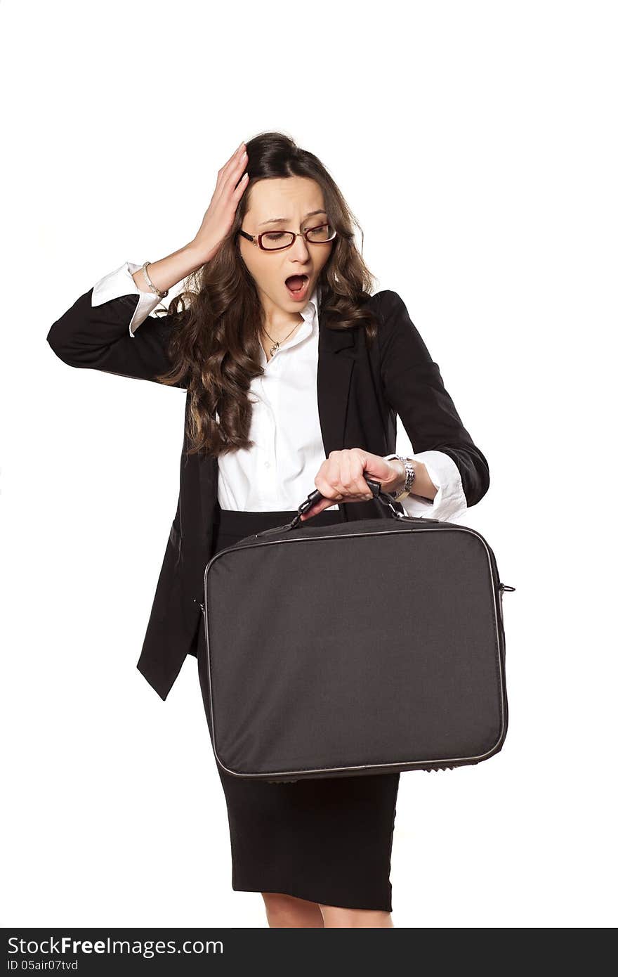 Worried business woman looking at the clock and holding the bag for laptop. Worried business woman looking at the clock and holding the bag for laptop