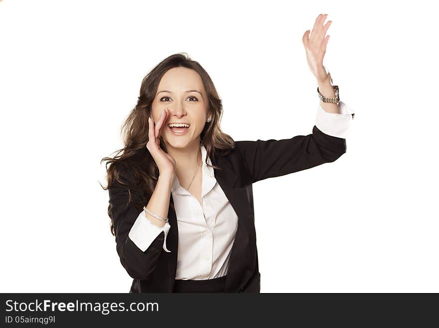 Satisfied and happy woman shouting with one hand next to her mouth