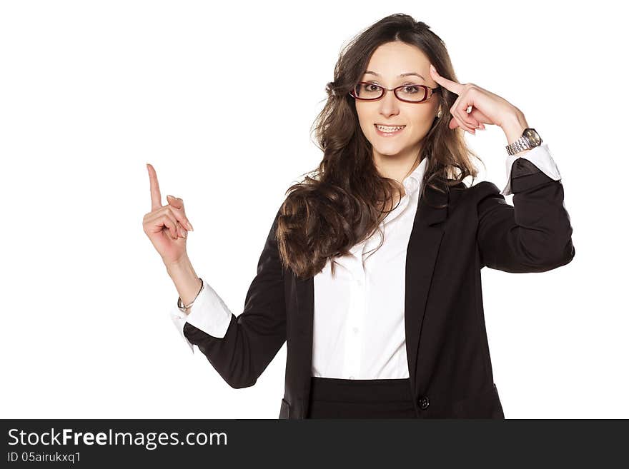 Smiling pretty business woman with a finger advertise the imaginary object. Smiling pretty business woman with a finger advertise the imaginary object