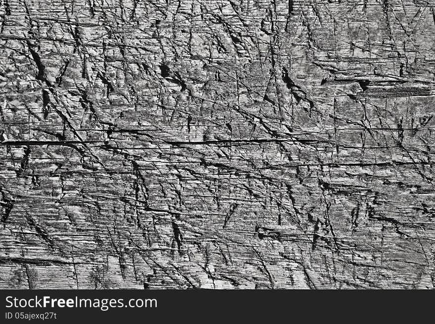 Fragment of old weathered rugged boards texture. Fragment of old weathered rugged boards texture