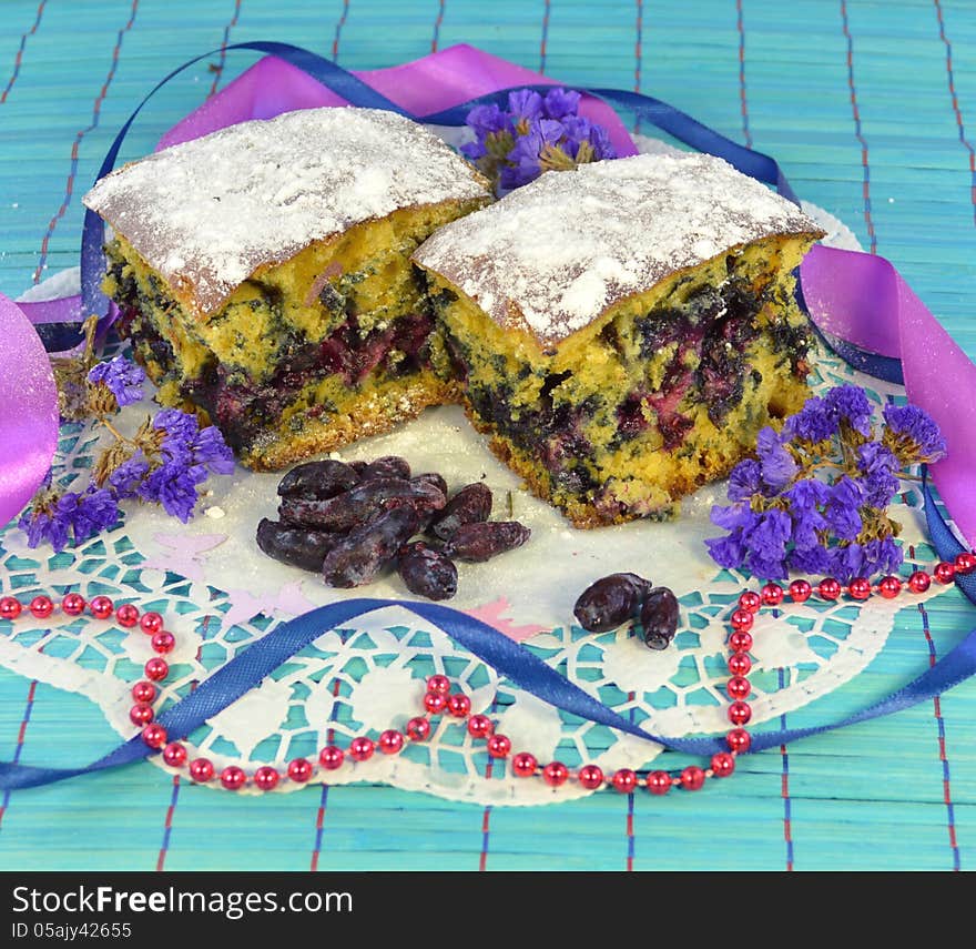 Home pie with fresh berries on the blue background. Home pie with fresh berries on the blue background