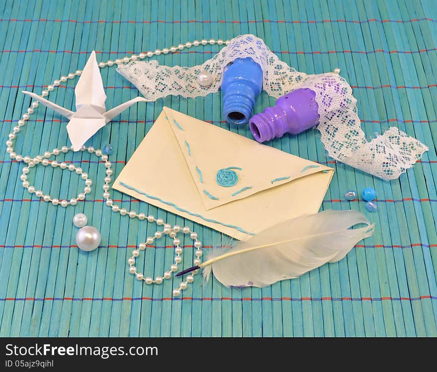 Paper envelope with bottles and origami bird. Paper envelope with bottles and origami bird