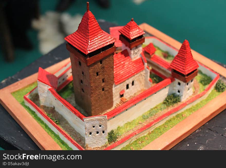Model fortress colored and surrounded by walls