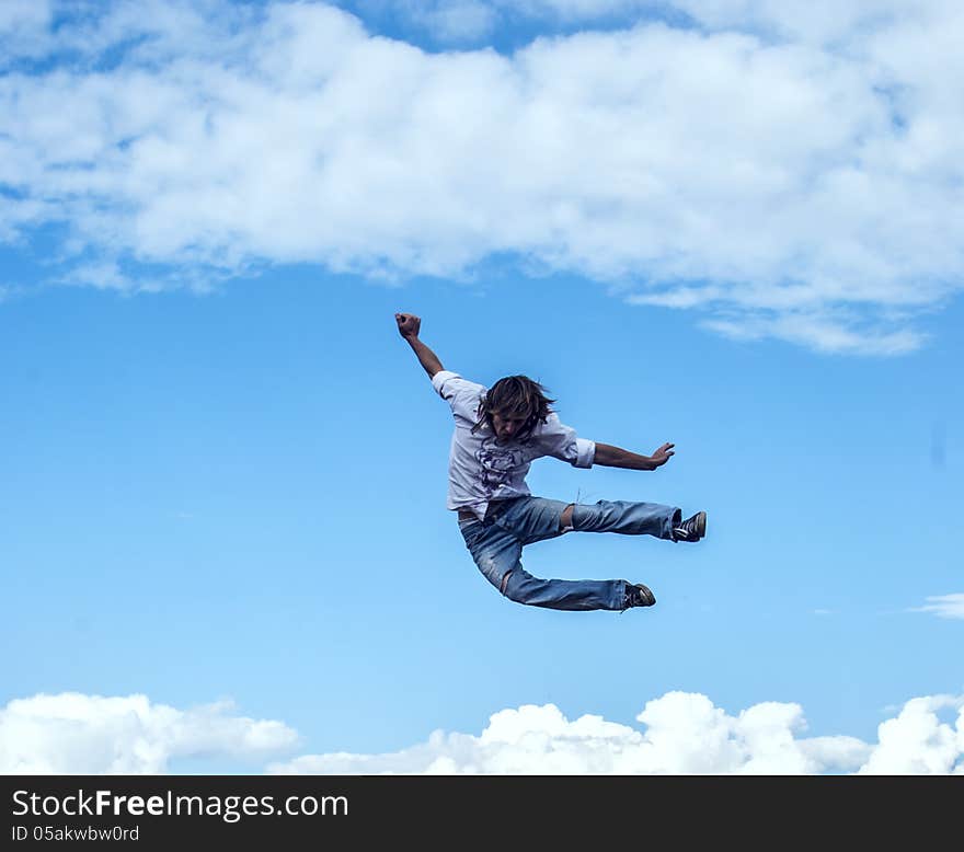 Guy Jumps Up Against The Sky Like He Is Free