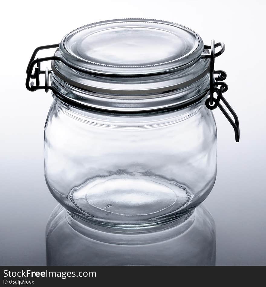 Closeup of an empty glass jar.