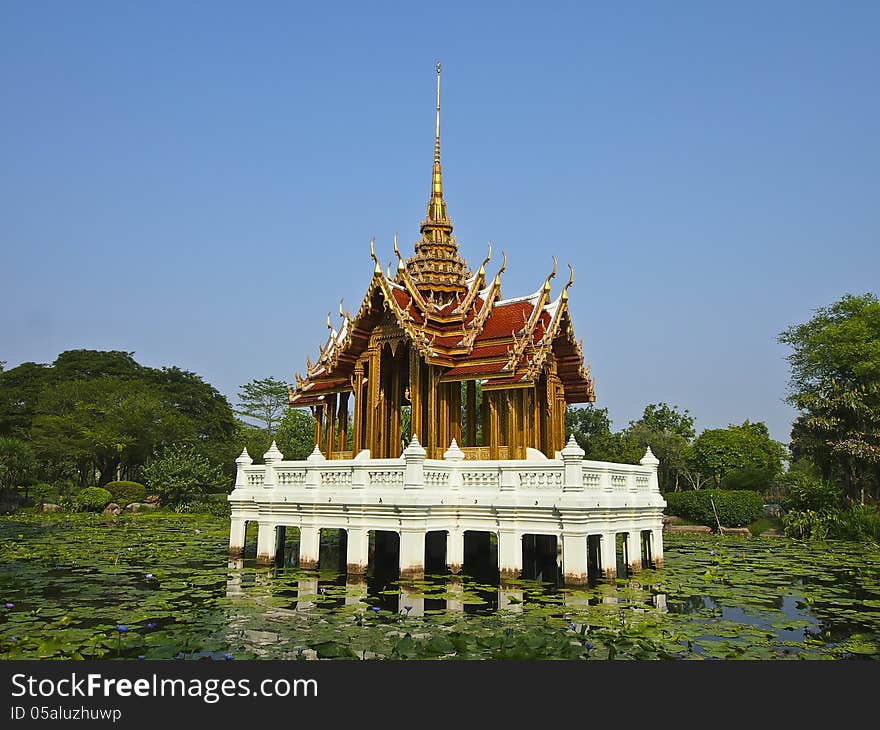 Pavilion at central of lotus pond in sunny day. Pavilion at central of lotus pond in sunny day