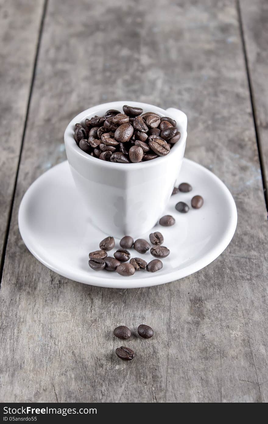 Coffee beans in espresso cup