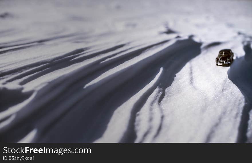 Little Lonely Black Model Of Retro Car On Snow