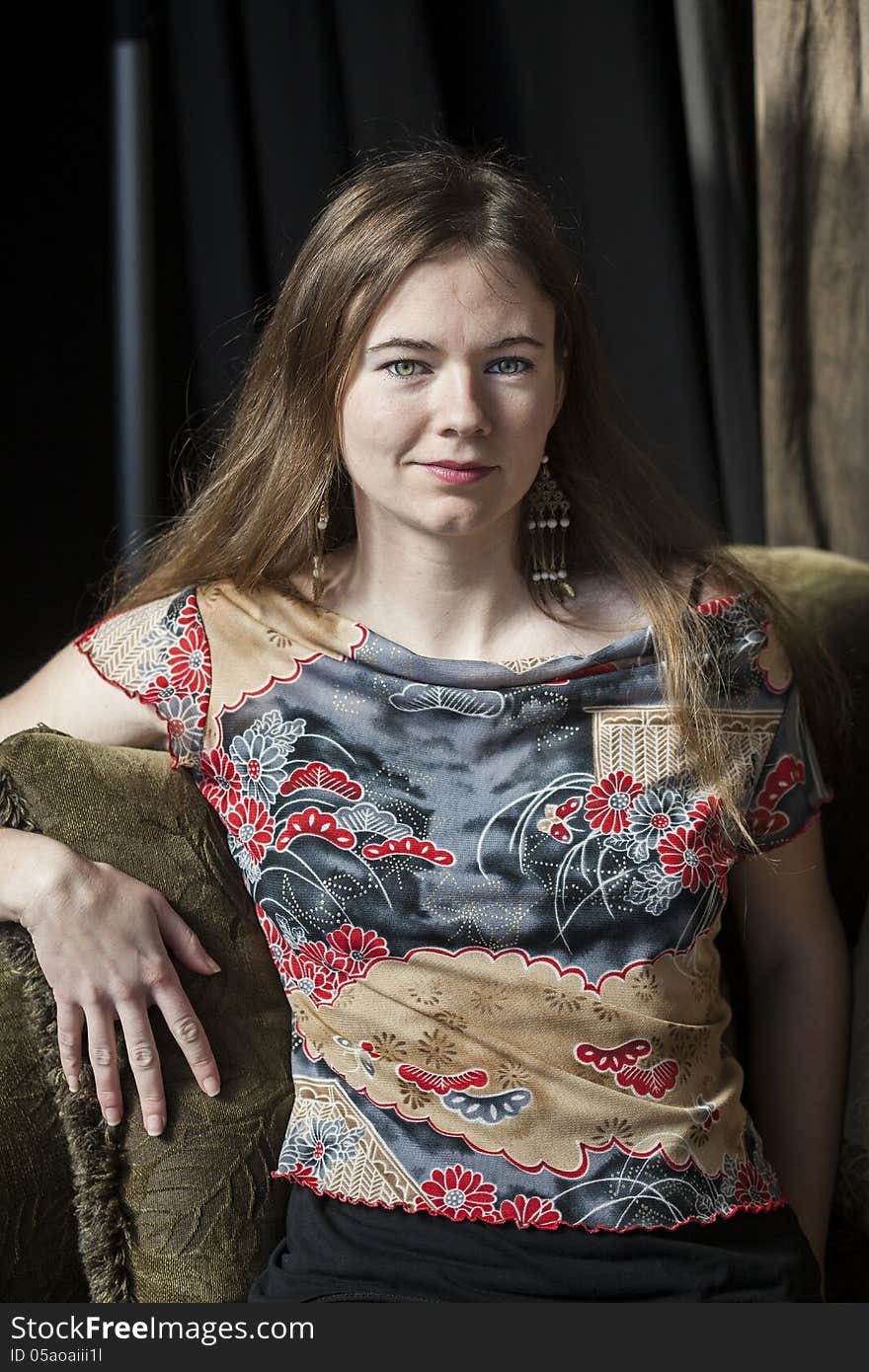 Portrait of a young woman looking directly at the camera. Portrait of a young woman looking directly at the camera