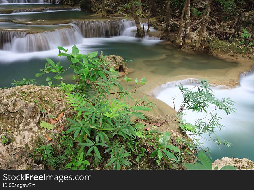 Small Trees on rocks and deep forest waterfall in Kanchanaburi, Thailand. Small Trees on rocks and deep forest waterfall in Kanchanaburi, Thailand