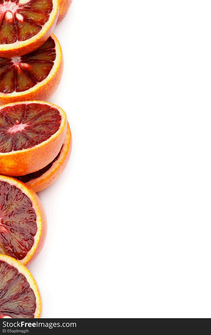 Halves of Perfect Ripe Blood Oranges as Frame closeup on white background. Halves of Perfect Ripe Blood Oranges as Frame closeup on white background