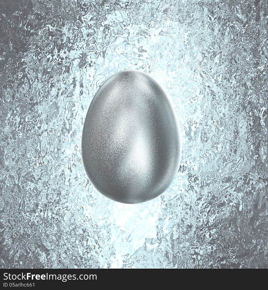 Bright Silver Easter Egg on a gold vintage background with clipping path. Bright Silver Easter Egg on a gold vintage background with clipping path