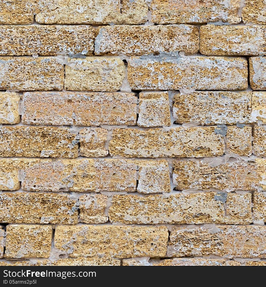 Sandstone Brick Wall with Cracks. Seamless Tileable Texture. Sandstone Brick Wall with Cracks. Seamless Tileable Texture.