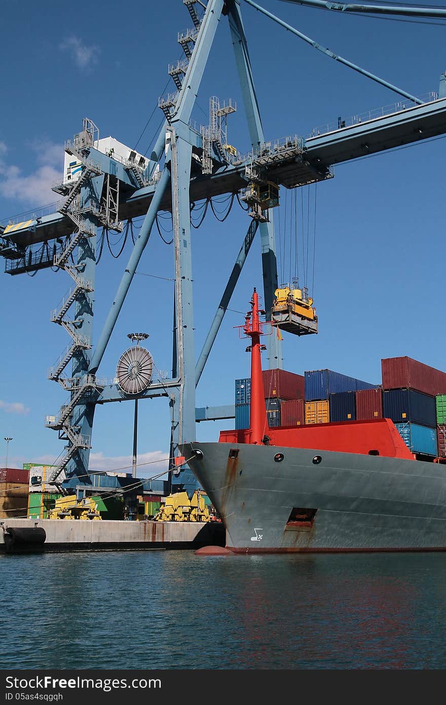 Crane and container ship working in the port of Alicante; Spain.