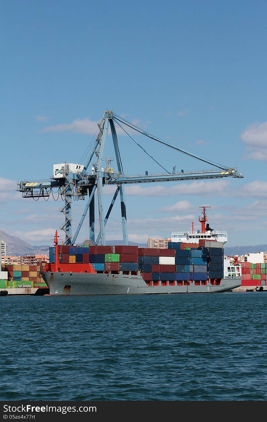 Crane and container ship working in the port of Alicante; Spain.