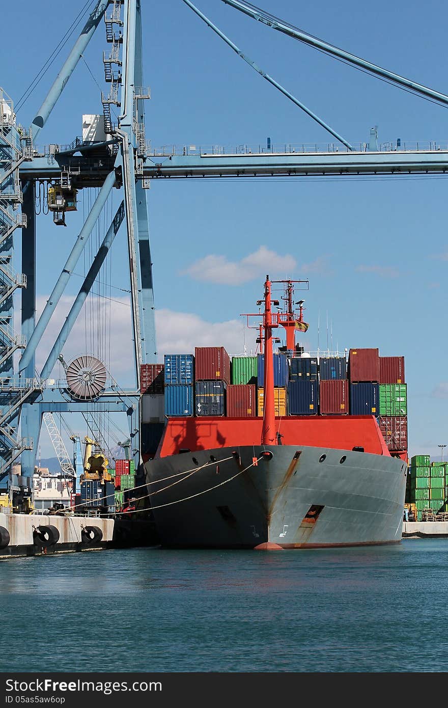 Crane and container ship working in the port of Alicante; Spain.