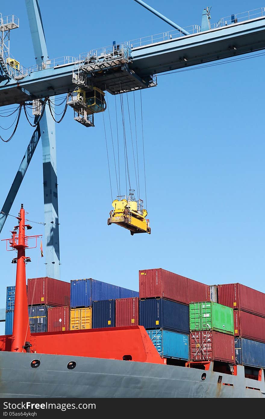 Crane and container ship working in the port of Alicante; Spain.